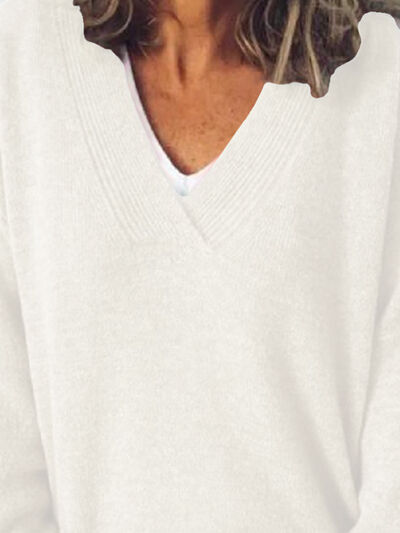 Dámský elegantní oversized svetr s výstřihem do V